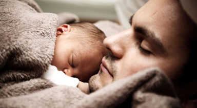Sleeping father and baby