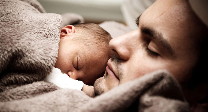 Sleeping father and baby